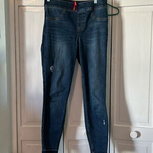 Spanx distressed skinny jeans.  Size M